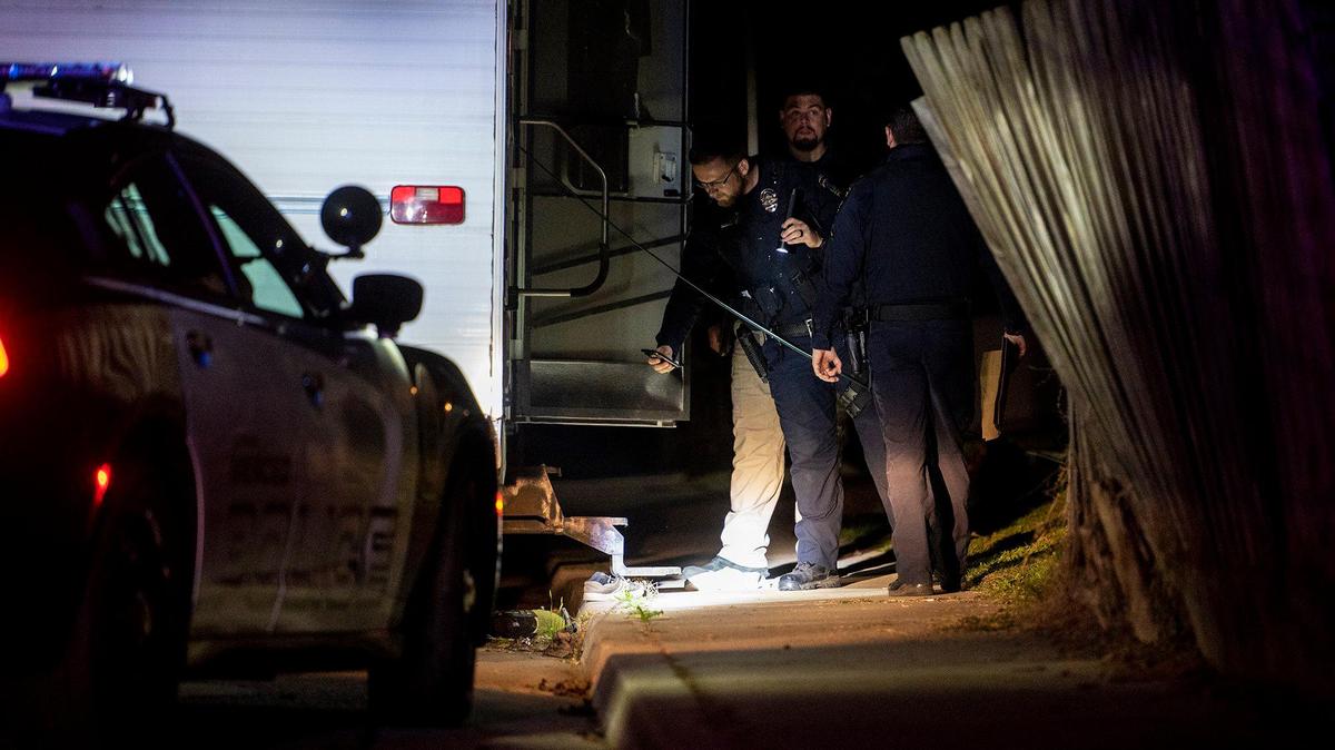 Merced Police Department detectives investigate the scene of a shooting that injured a 27-year-old man in the 1500 block of La Mirada Drive in Merced, Calif., on Monday, Jan. 31, 2022.