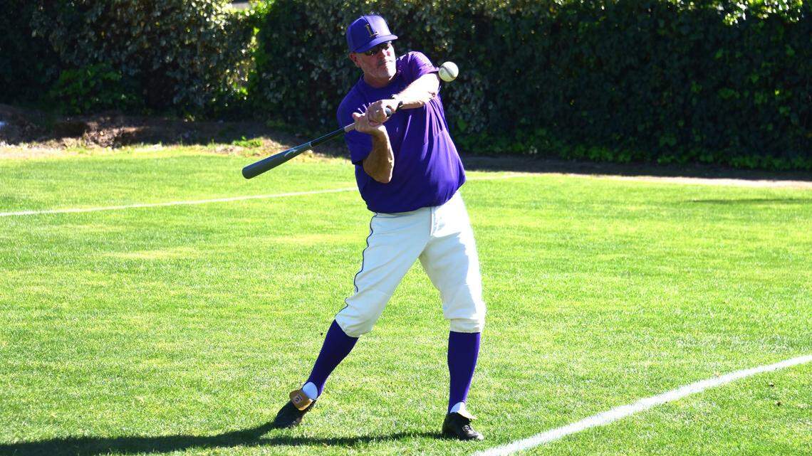 Livingston High School baseball coach Matt Winton hits flyballs during pregame warmups before a Wolves game on Tuesday, April 2, 2024 at Atwater’s Memorial Ballpark. Winton has coached his alma mater for 31 seasons.