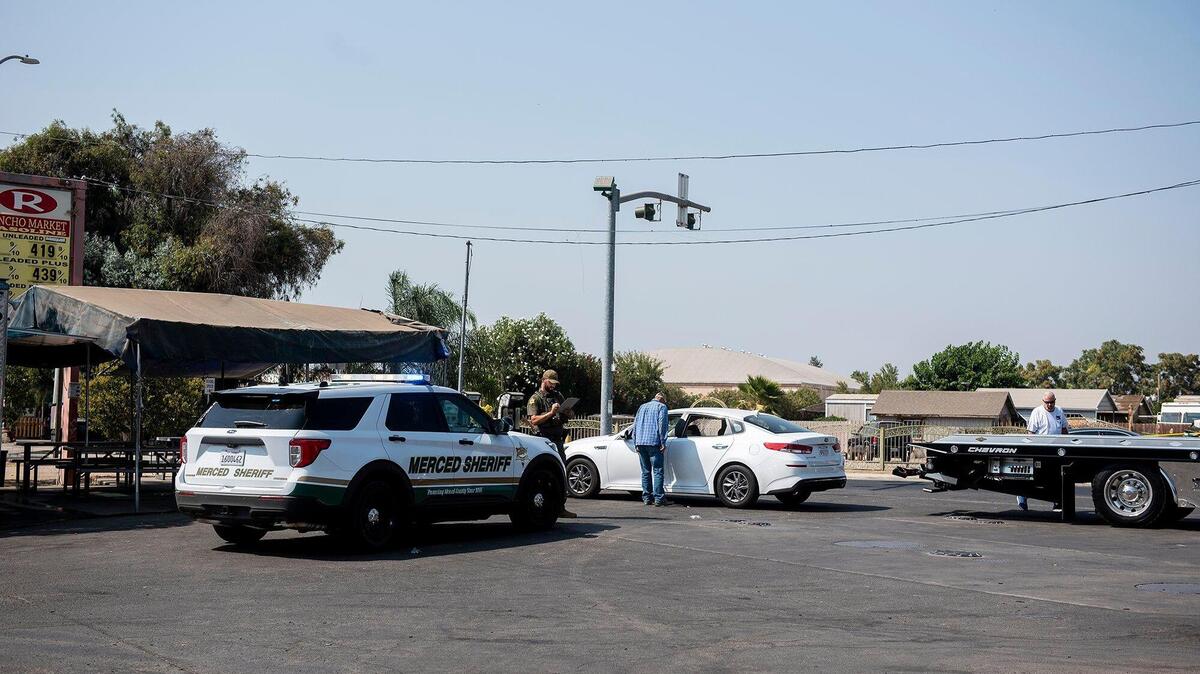 The Merced County Sheriff’s Office investigates the scene of a shooting homicide at a taco truck outside the Rancho Market near the intersection of Santa Fe Drive and Walnut Avenue in Winton, Calif., on Tuesday, Aug. 24, 2021. According to authorities, one victim was pronounced dead on scene and a second victim was transported to a hospital.