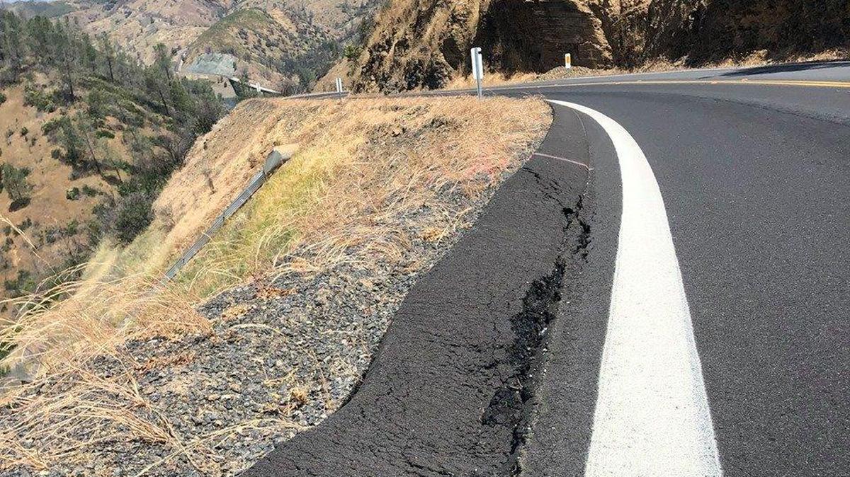 This photo published on May 9, 2019 by they California Department of Transportation, shows a crack at the edge of Highway 49 in Mariposa County. According to Caltrans, Highway 49 from Bear Valley Road to Highway 132 is open to both northbound and southbound traffic following a closure that began on April 29. Photo courtesy of the California Department of Transportation.