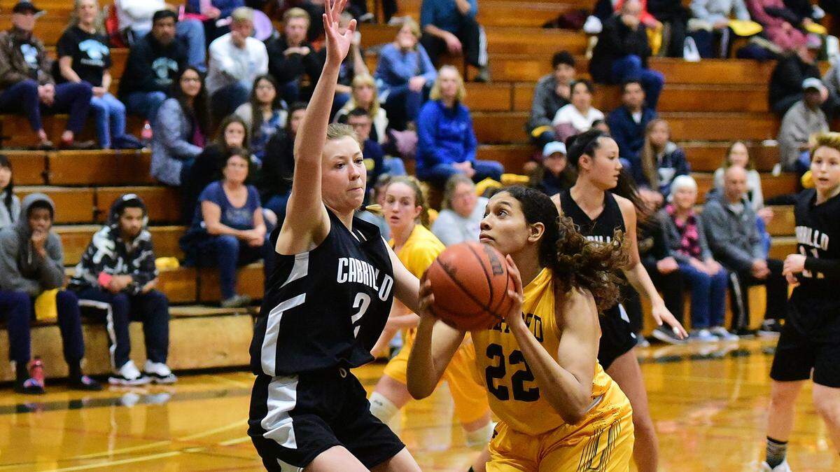 Merced College freshman Jada Johnson (22) drives to the basket during a game against Cabrillo College in Merced, Calif., on Saturday, March 9, 2019. 