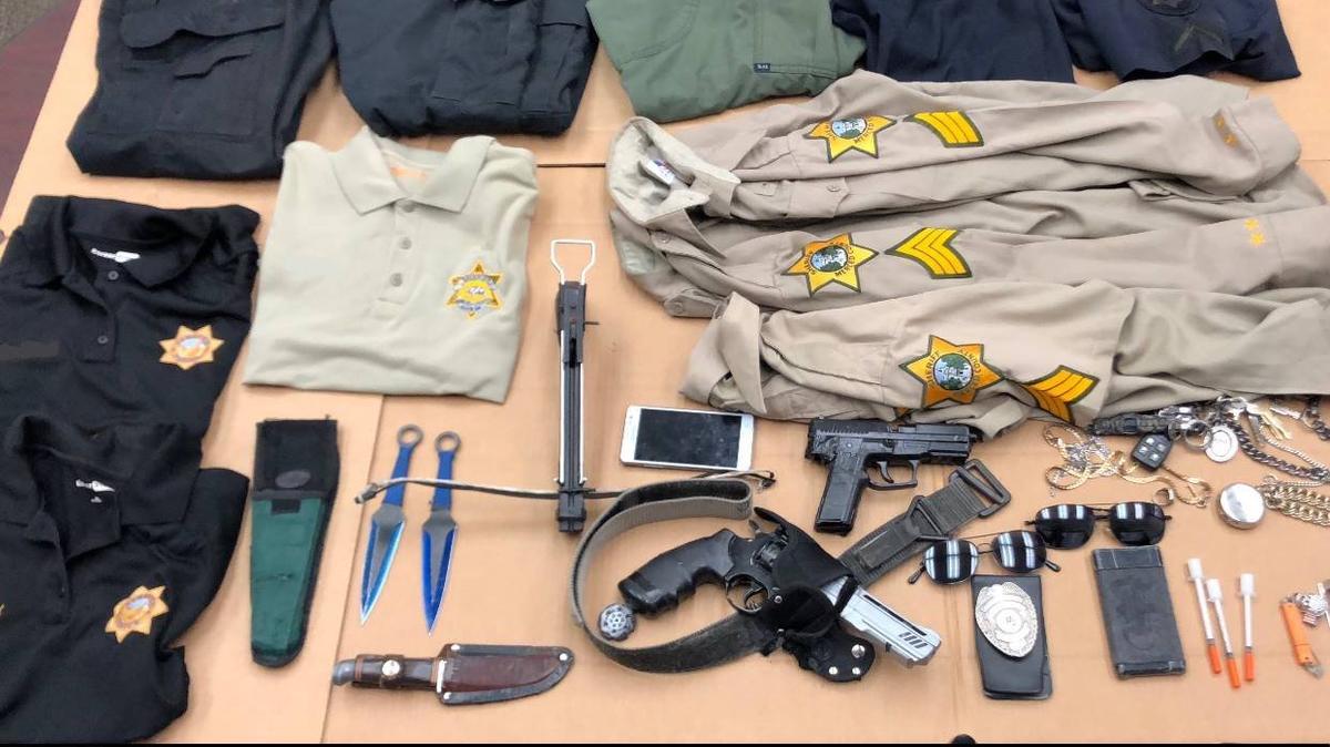 The Merced County Sheriff’s Office says deputies found law enforcement uniforms, daggers and replica weapons at a home in Atwater on Thursday. Photo courtesy of the Merced County Sheriff’s Office.