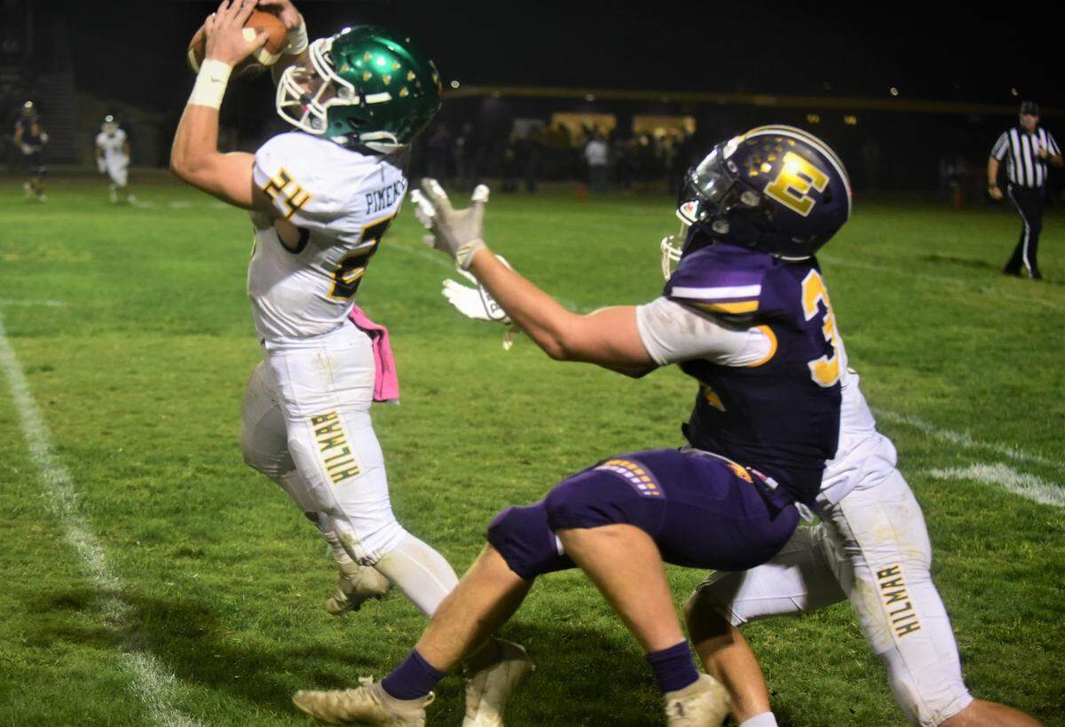 Hilmar senior defensive back Jason Pimentel comes away with an intercption in front of Escalon tight end EJ Lewis during a game on Friday, Oct. 1, 2021 at Engel Field in Escalon, Calif.