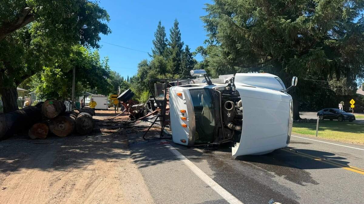 A semi carrying lumber overturned on Friday, July 10, 2026.