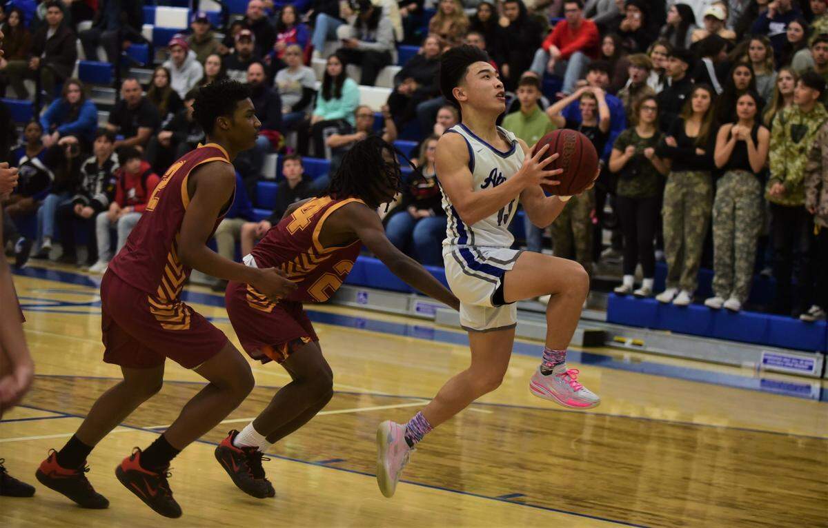 Atwater High School junior Khoi Nguyen drives to the basket during a game against Golden Valley on Friday, January 6, 2022 at Atwater High School.