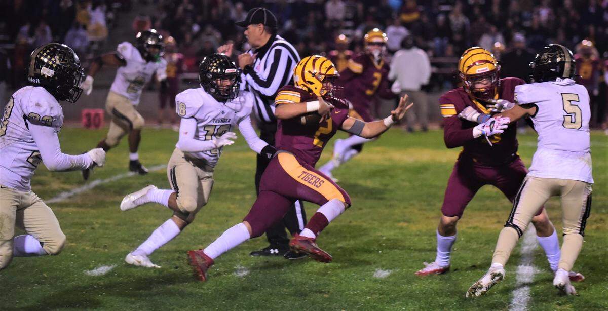 Los Banos HIgh School junior quarterback David Herrera runs the ball during a playoff game against Buhach Colony on Friday, Nov. 4, 2022.
