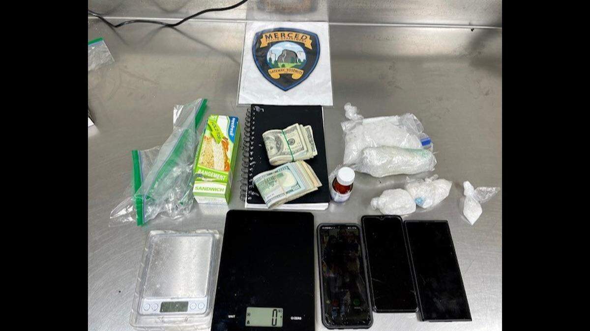 Merced Police officers arrested two men at a Turlock hotel after locating narcotics, drug paraphernalia and about $7,000 in cash after serving a search warrant on Saturday.