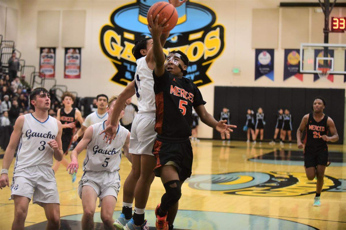 Merced High senior Koen Tyler (5) goes up for a shot during a game on Wednesday, Jan. 4, 2022 at El Capitan High School.