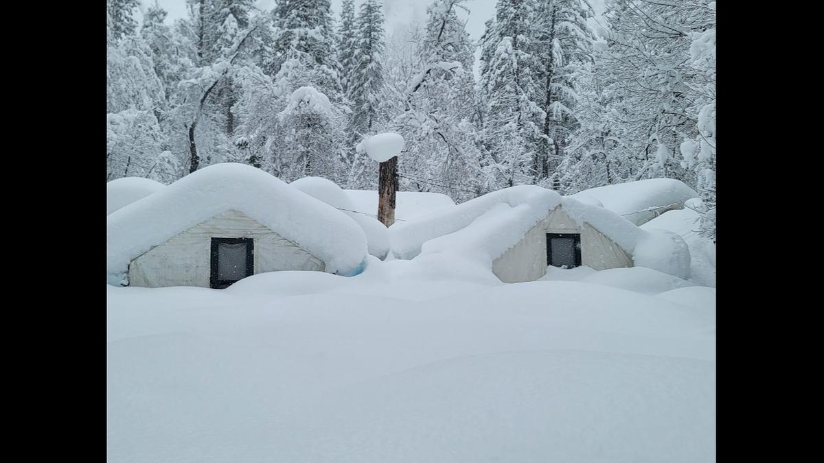 Tent cabins at Curry Village in Yosemite National Park are nearly covered in snow. Yosemite is closed to visitors after the park experienced significant snowfall with some areas recording up to 15 feet of snow, according to the National Park Service Facebook post on Tuesday, Feb. 28, 2023. Image courtesy of Yosemite National Park.