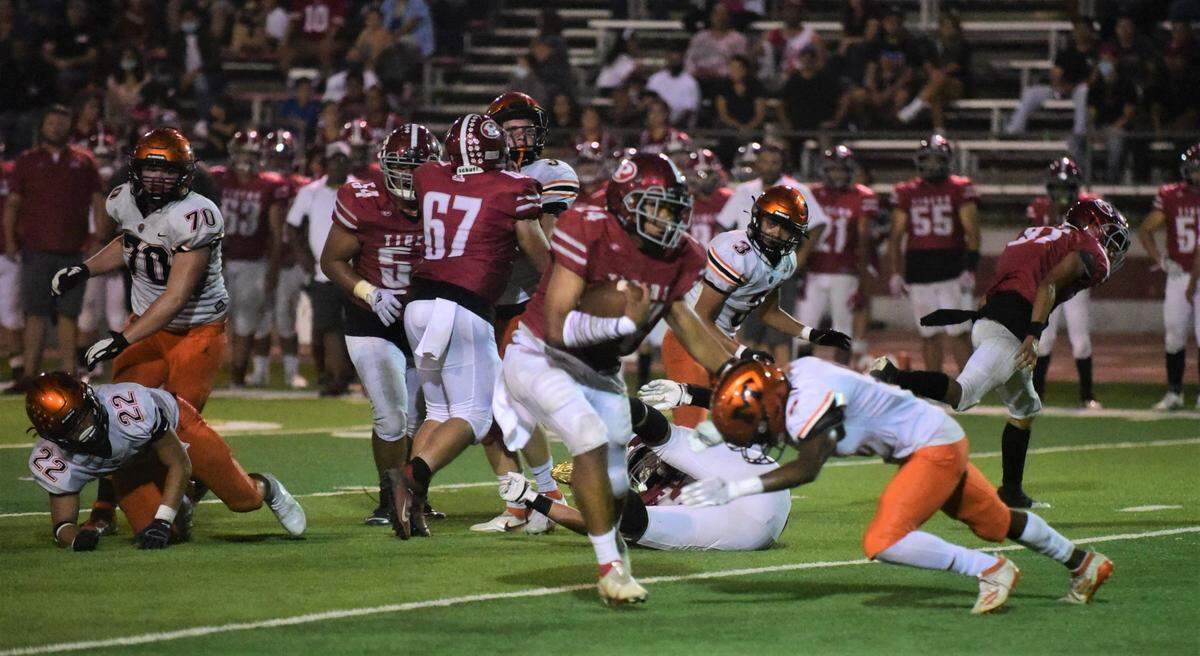 Patterson running back Lolo Mataele runs the ball during a game against Merced at Patterson Community Stadium on Friday, Sept. 24, 2021.