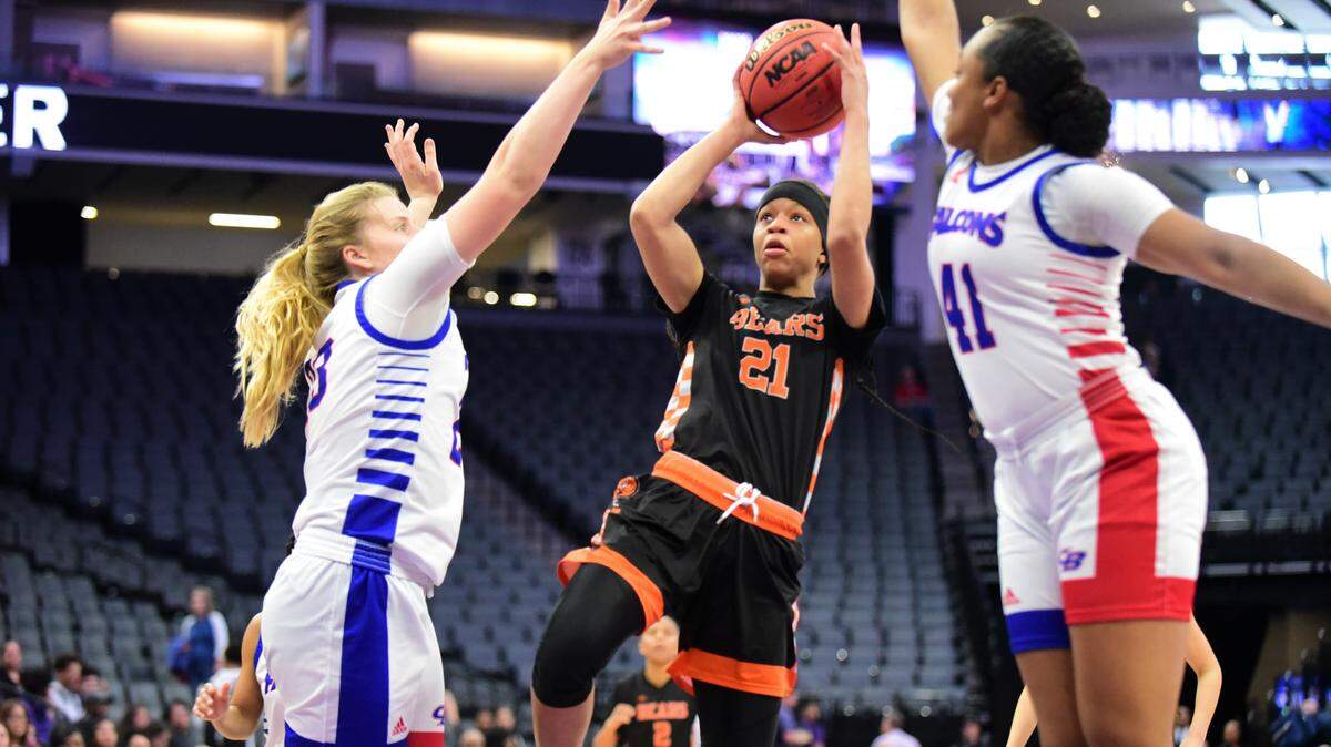 Merced High senior Khya Martin goes up for a shot against Christian Brothers players Laney Prichard (23) and Bria Shine (41) during the Sac-Joaquin Section Division III championship game at Golden 1 Center in Sacramento on Friday, Feb. 28, 2020.
