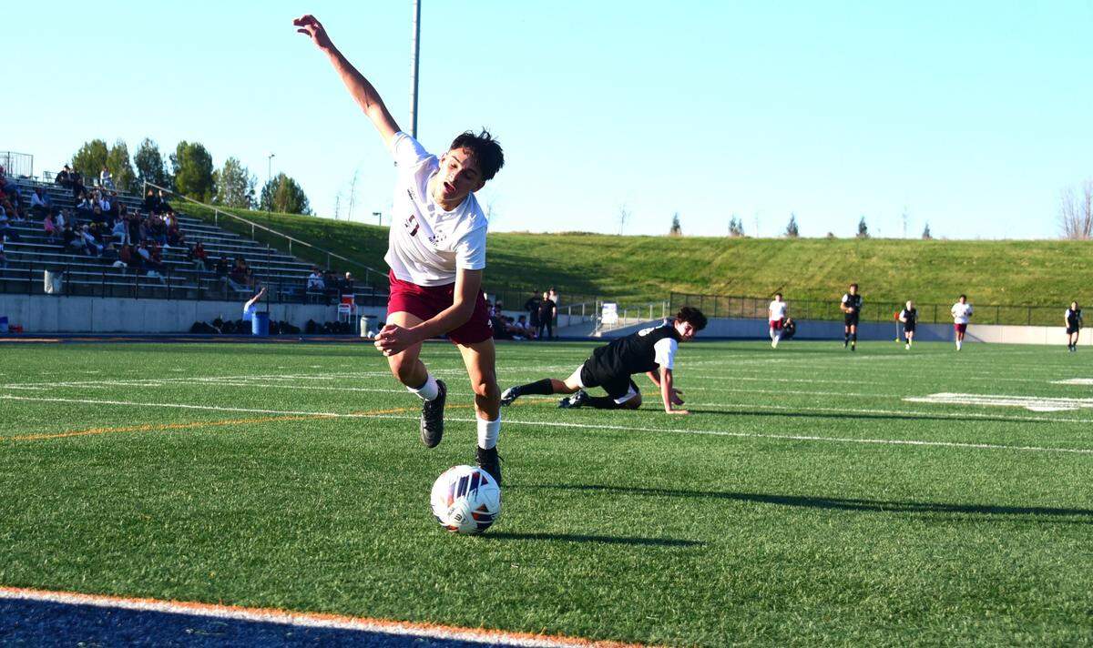 Golden Valley High senior Carlos Miranda (9) tries to chase down a ball before it rolls out of bounds during the Sac-Joaquin Section Division II championship match against Delo Oro at Cosumnes River College in Sacramento, Calif. on Saturday, Feb. 24, 2024.