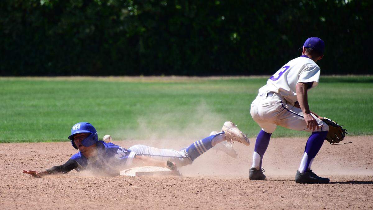 Mountain House senior Andres De Leon is hit in the head with the ball while stealing second base during a 5-2 win over Livingston on Wednesday, April 24, 2019 at Memorial Ballpark in Atwater, Calif.