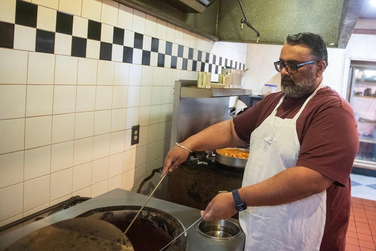 Parm Samra, 55, owner of Taste of Little India, explains how he uses a clay oven to cook food at the restaurant’s 1052 W. Main Street location in Merced, Calif., on Thursday, April 3, 2025. Samra said he was informed that the building has changed ownership and his lease has been terminated. The restaurant will close on April 11.