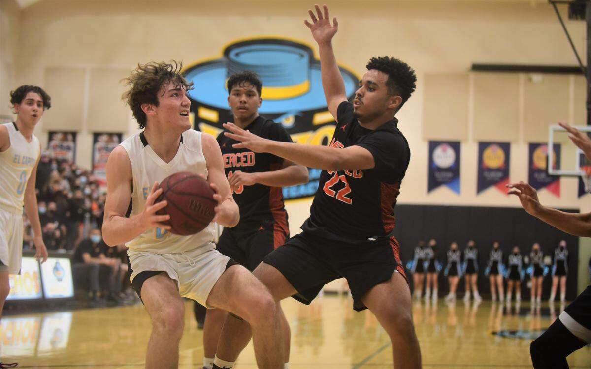 El Capitan High junior Will Bain looks to go up for a shot against Merced’s Seth Mays-Meneley during a game at El Capitan High School on Monday, Feb. 7, 2022.