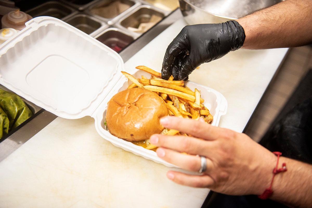 Line cook Alan Zamora, 34, prepares an order at the historic Mainzer Theater in Merced, Calif., on Thursday, Aug. 15, 2024. A new menu crafted by Executive Chef Evan Morrison, is set to debut on Friday Aug. 16.