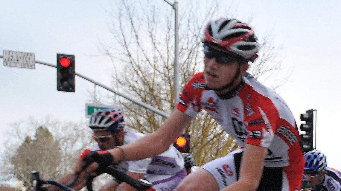 SUN-STAR PHOTO BY LISA JAMES A Pee-Wee racer watches as the big boys, the Elite Pros, whiz by him on the corner of M and 23rd Street Saturday. Hundreds of cyclists, including many of cycling’s top names, take over the streets of downtown Merced for the annual MERCO Downtown Ground Prix, an all day event drawing a crowd of hundreds Saturday. March 6, 2010