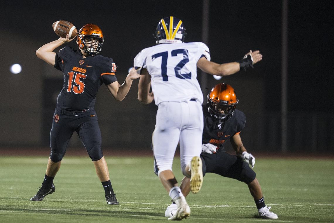 Merced senior quarterback Junior Garcia (15) throws the ball during a game against Gregori at Veterans Stadium on the campus of Golden Valley High School in Merced, Calif., on Friday, Aug. 24, 2018. The Bears beat the Jaguars 41-22.