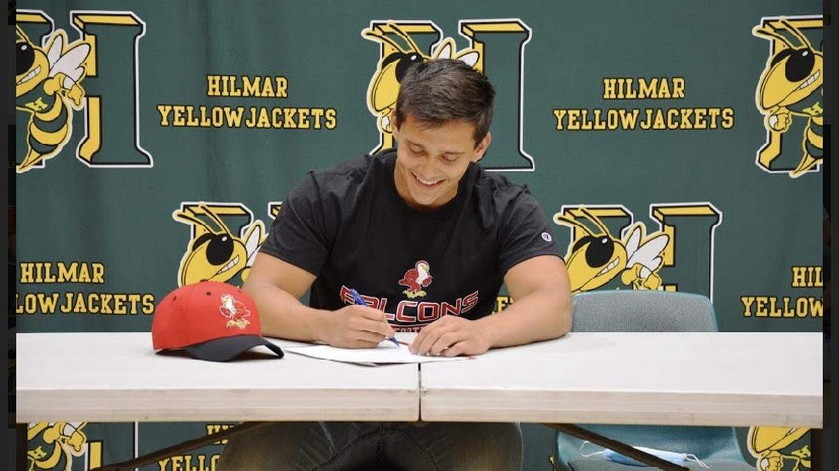 Hilmar High senior Trace Van Guilder signed his national letter of intent to play football at Friends University in Kansas during a cereomony in the school gym at Hilmar High on Friday, May 7, 2021.