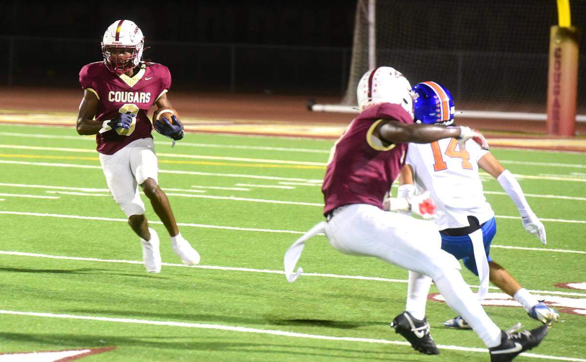 Golden Valley High receiver Josiah McCray runs the ball during a game against Kimball on Friday, Sept. 20, 2024 at Veterans Stadium in Merced, Calif.