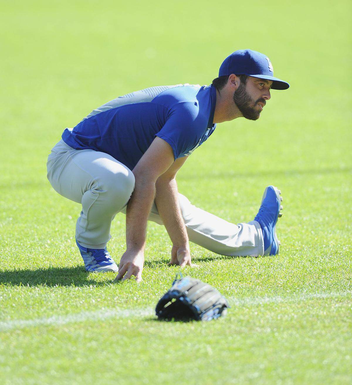 Los Angeles Dodgers relief pitcher Dylan Floro stretches before a game against the San Francisco Giants at AT&T Park in San Francisco near the end of the regular season. 