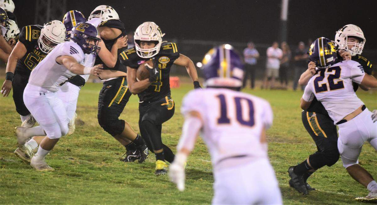 Hilmar High running back Luis Vargas runs for a 51-yard touchdown in the first quarter against Escalon in a 21-20 win by the Yellowjackets on Friday, Sept. 30, 2022 in Hilmar, Calif.