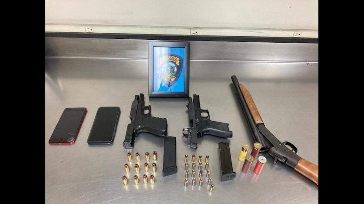An 18-year-old Merced man was arrested after police officers said they found a stolen firearm and other weapons in his residence on Friday.