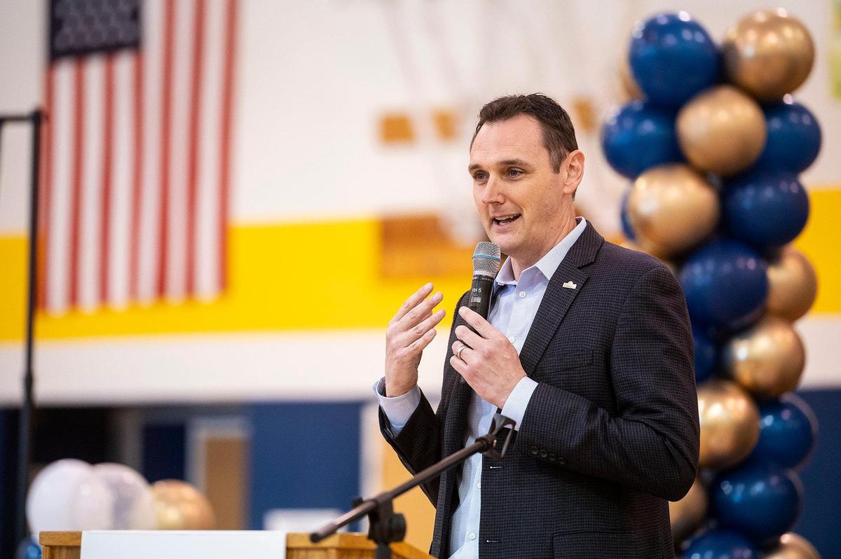Comcast Director of Government Affairs for the South Valley, Nathan Ahle, speaks to eighth-graders during a ceremony announcing a $4.5 million investment to bring high-speed internet and broadband services to the area, at Cesar E. Chavez Middle School in Planada, Calif., on Monday, April 17, 2023. According to Ahle, the $4.5 million investment involves extending the existing network from nearby Merced into the town of Planada.