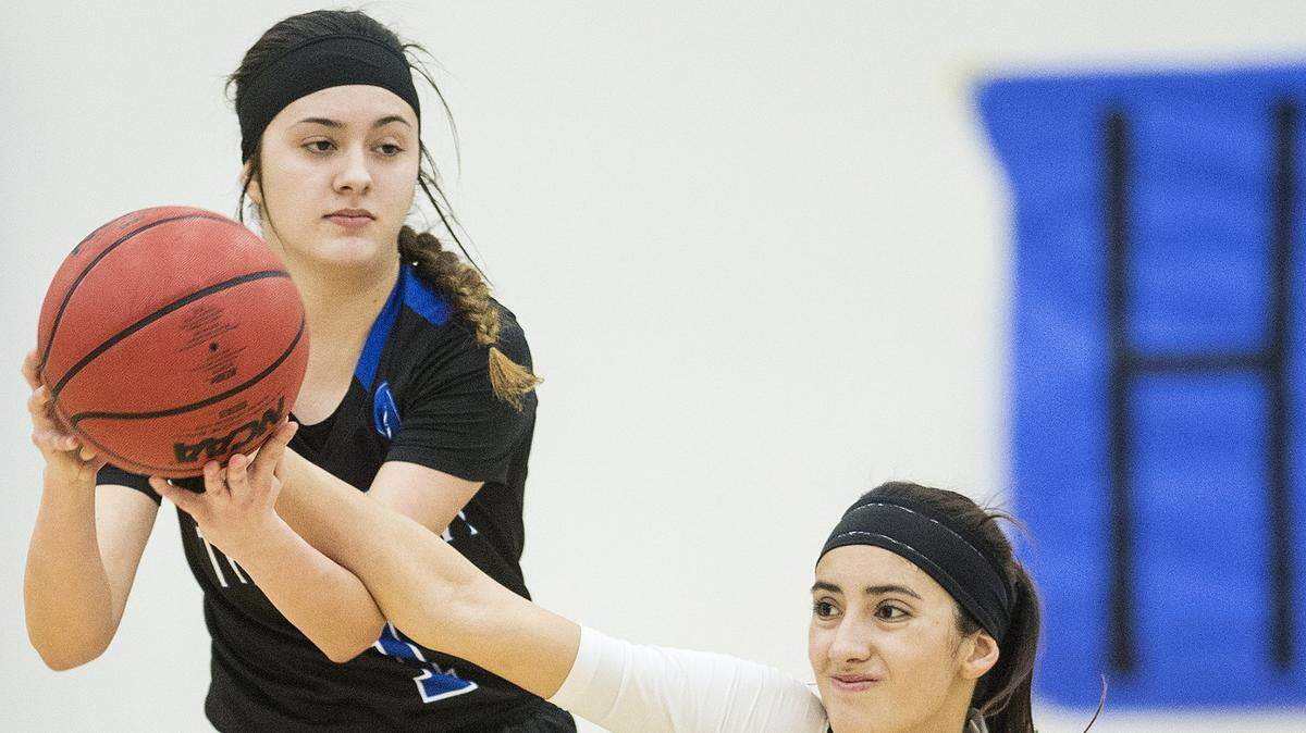 Atwater senior Kelsey Valencia (1), left, and Buhach Colony junior Caly Curran (1), right, fight for possession fo the ball during a game at Atwater High School. Valencia was named the CCC Most Valuable Player by the conference coaches.