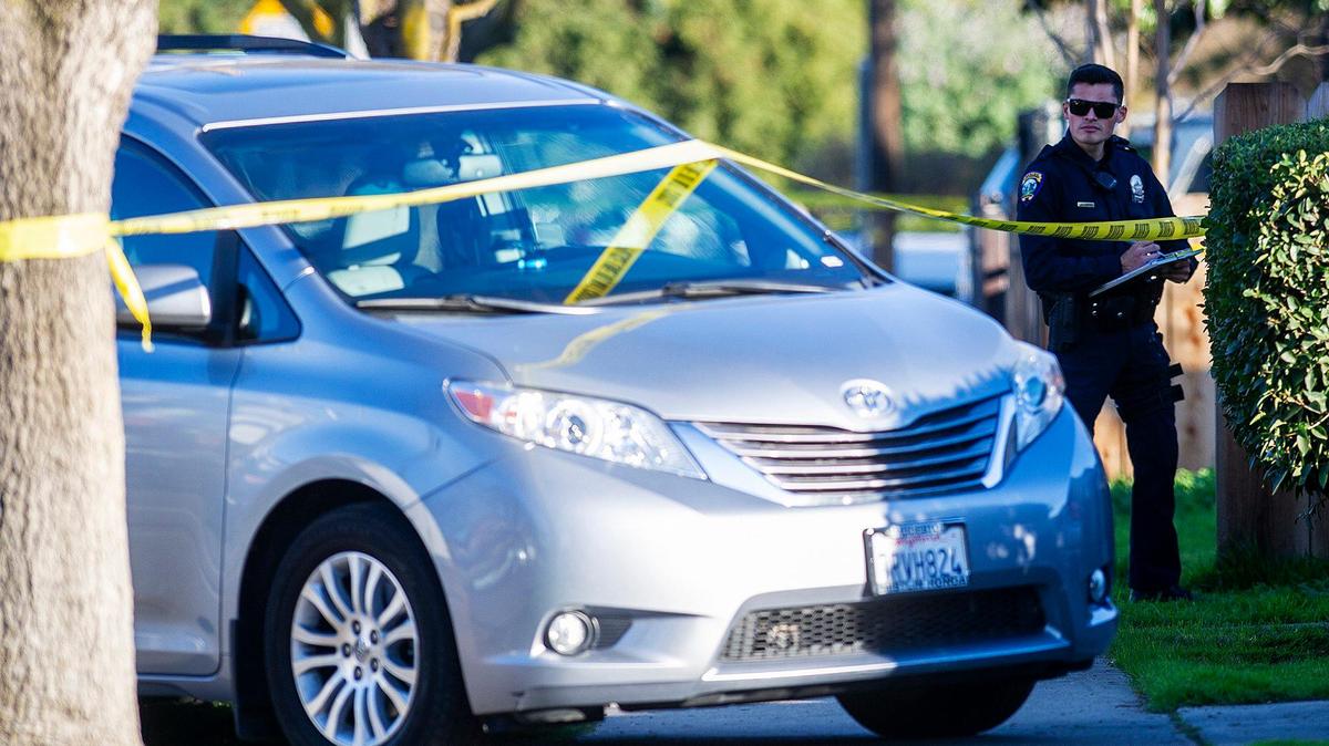 Police investigate a shooting in the 600 block of West 11th Street, that left a 22-year-old man dead in Merced, Calif., on Wednesday, Feb. 10, 2021. A 14-year-old male suspect was arrested by officers running from the scene, according to the Merced Police Department. The victim was pronounced dead at an area hospital.