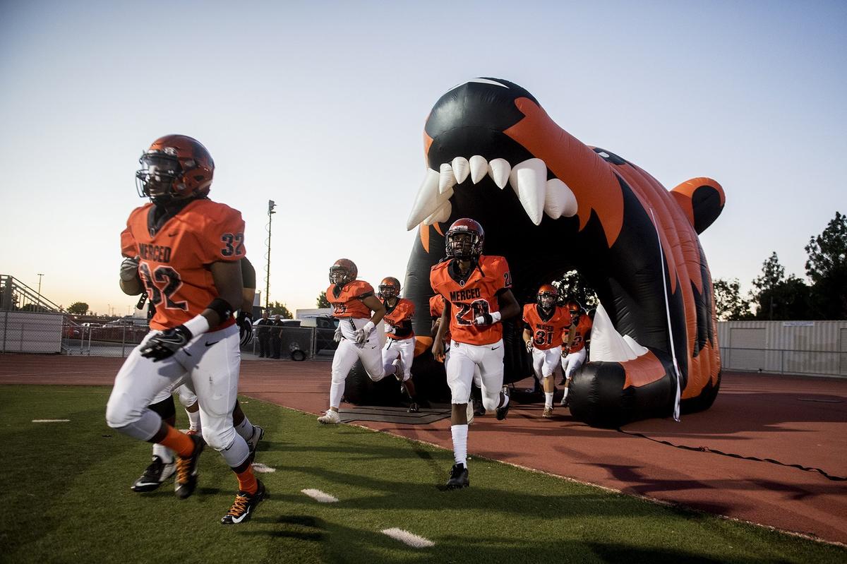 The Merced Bears take the field during a game against Madera at Veterans Stadium on the campus of Golden Valley High School in Merced, Calif., on Friday, Sept. 7, 2018. The Bears beat the Coyotes 63-35.