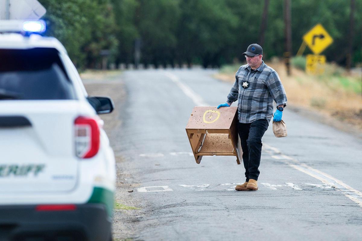 The Merced County Sheriff’s Office investigates the scene of a homicide after a woman was found dead with a gunshot wound at a residence in the 4600 block of Lingard Road in Merced County, Calif., on Sunday, Sept. 3, 2023.