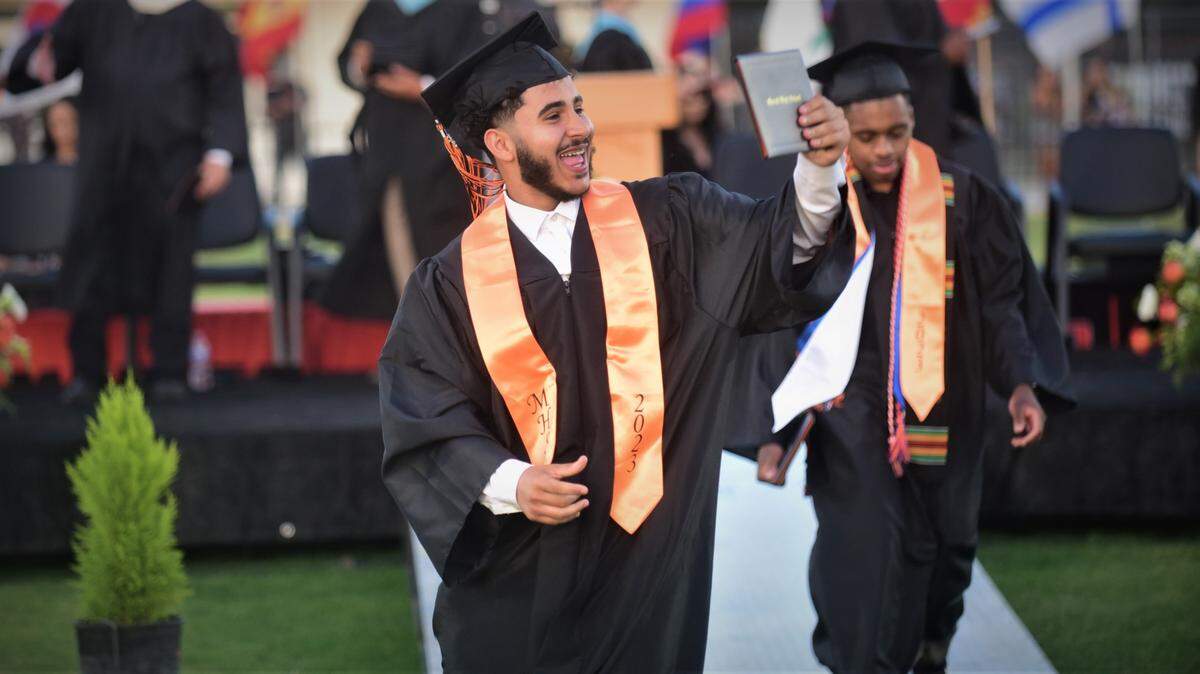 Merced High School graduate Mohammed Mohammed makes his way off the stage after receiving his diploma during the school’s graduation ceremony on Thursday, June 1, 2023.