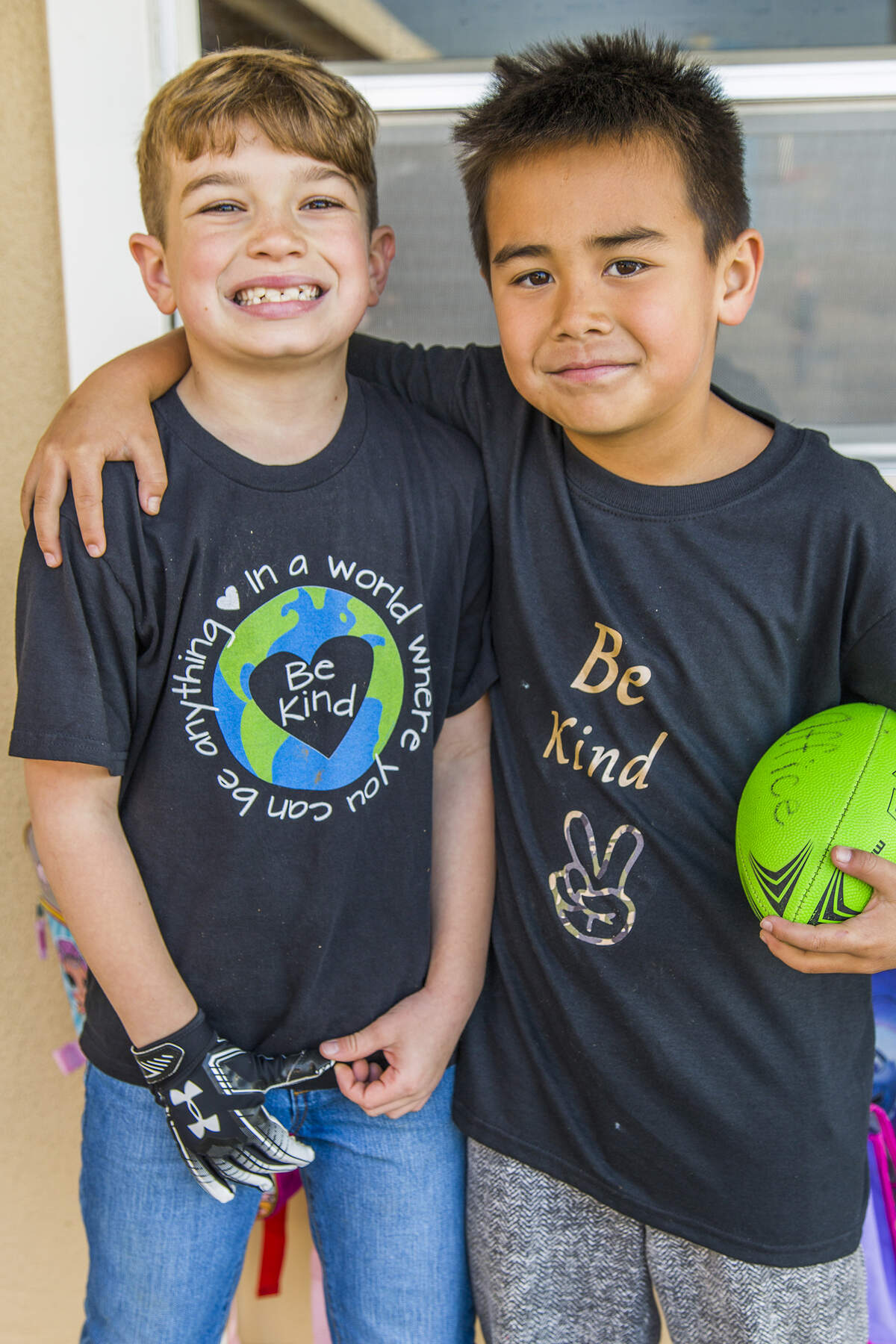 Charleston Elementary students Maximus Medeiros (left) and Tripp Kim wear kindness shirts.