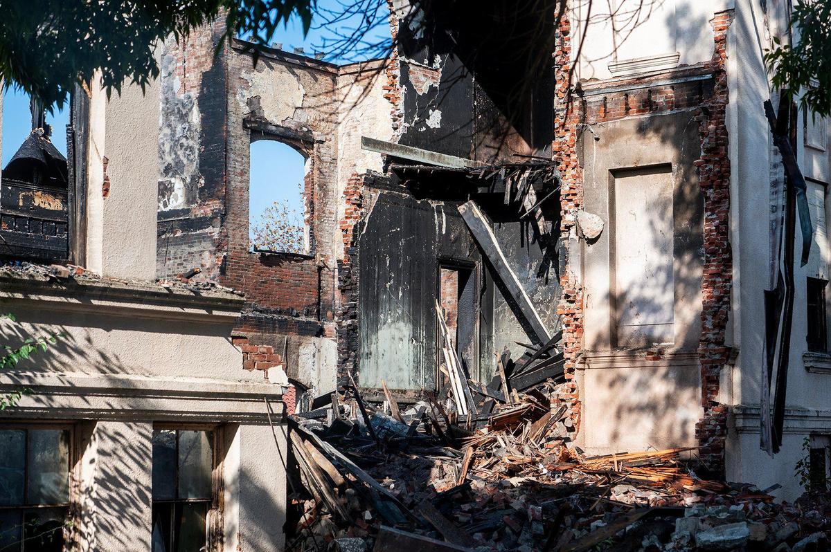 The remains of a historic 19th century building and the first Merced County building constructed as a high school, after a fire damaged the structure located at 2125 M Street in Merced, Calif., on Tuesday, Dec. 3, 2024. Both city and county firefighters responded to the blaze which broke out inside the structure Monday morning.