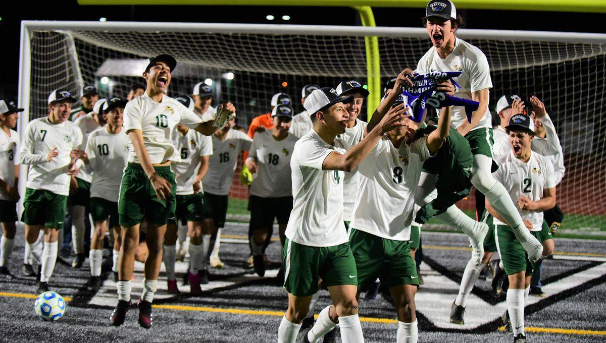 The Hilmar High boys soccer team celebrates after winning the Sac-Joaquin Section Division V championship with a 5-4 overtime win over Linden at Liberty Ranch High School in Galt, Calif. on Saturday, Feb. 22, 2020.