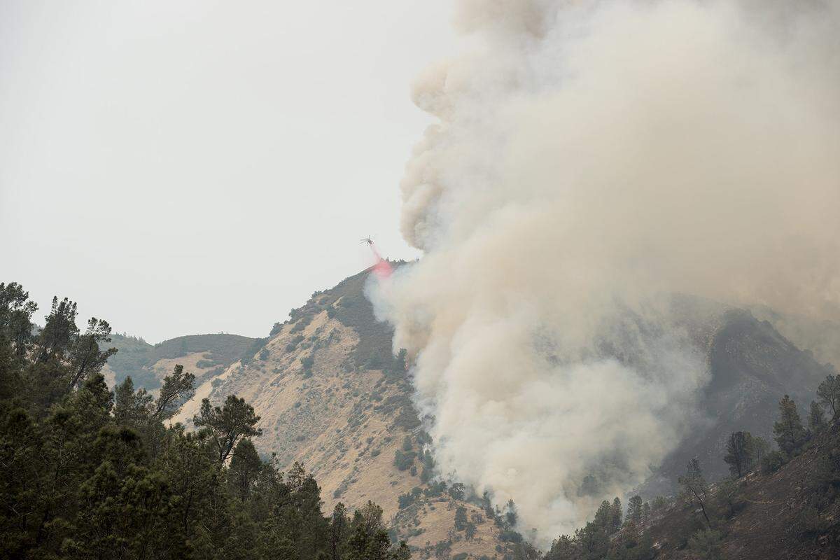 The Ferguson Fire continues to burn on the north side of Highway 140 and the Merced River in Mariposa County, Calif., on Saturday, July 21, 2018. According to California Department of Forestry and Fire Protection Public Information Officer, Michael Whitaker, the fire has burned over 27,000 acres and is seven percent contained.
