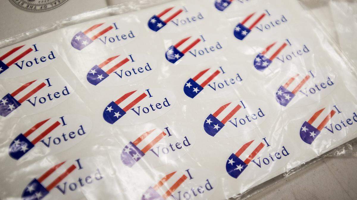 Stickers wait to be handed out to voters at the Merced County Administration Building in Merced, Calif., on Tuesday, Nov. 6, 2018. 