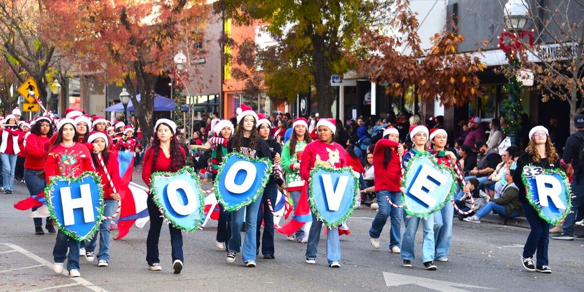 The Hoover Middle School marching band makes their way down Main Street during the annual Merced Christmas Parade on Saturday, Dec. 2, 2023 in Merced, Calif.