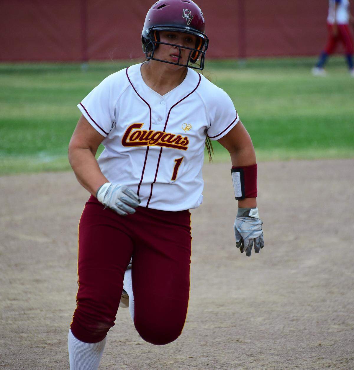 Golden Valley High junior Vanessa Saltos rounds third base on a Maddy Stokes’ triple during the fifth inning of the Cougars’ 7-0 playoff win over East Union on Wednesday afternoon at Golden Valley High.