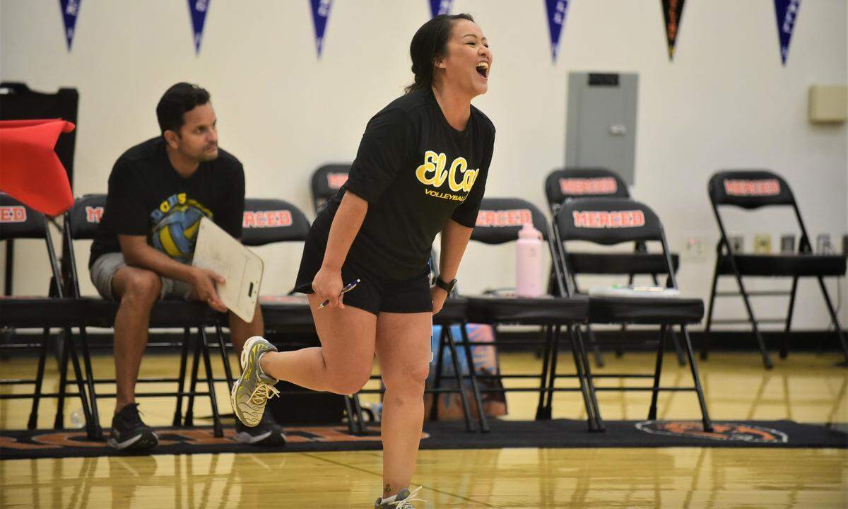 El Capitan High School volleyball coach Chela Moreno cheers on her team during a match against Merced on Wednesday, Sept. 7, 2022.