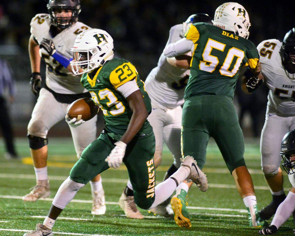 Hilmar running back Issac Sharp (23) sprints upfield during the Division VI CIF Sac-Joaquin championship game between Ripon Christian and Hilmar at Turlock High School in Turlock CA on November 30, 2018.