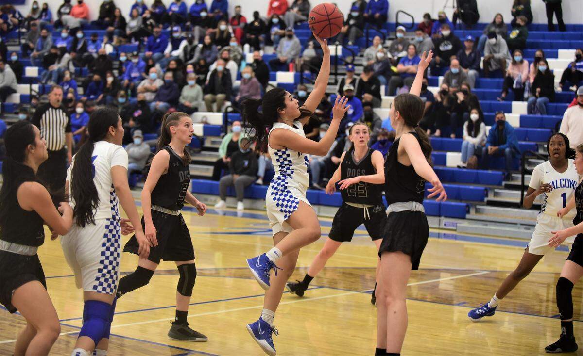 Atwter High senior Aliene Lopez goes up for a shot against Tracy during a playoff game at Atwater High School on Thursday, Feb. 17, 2022.