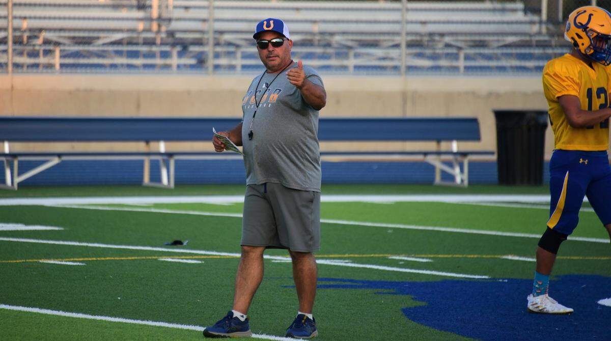 Dos Palos High School head coach Rob Calvert led the Broncos to a 10-1 season last year. Dos Palos celebrates its 100th football season this year.