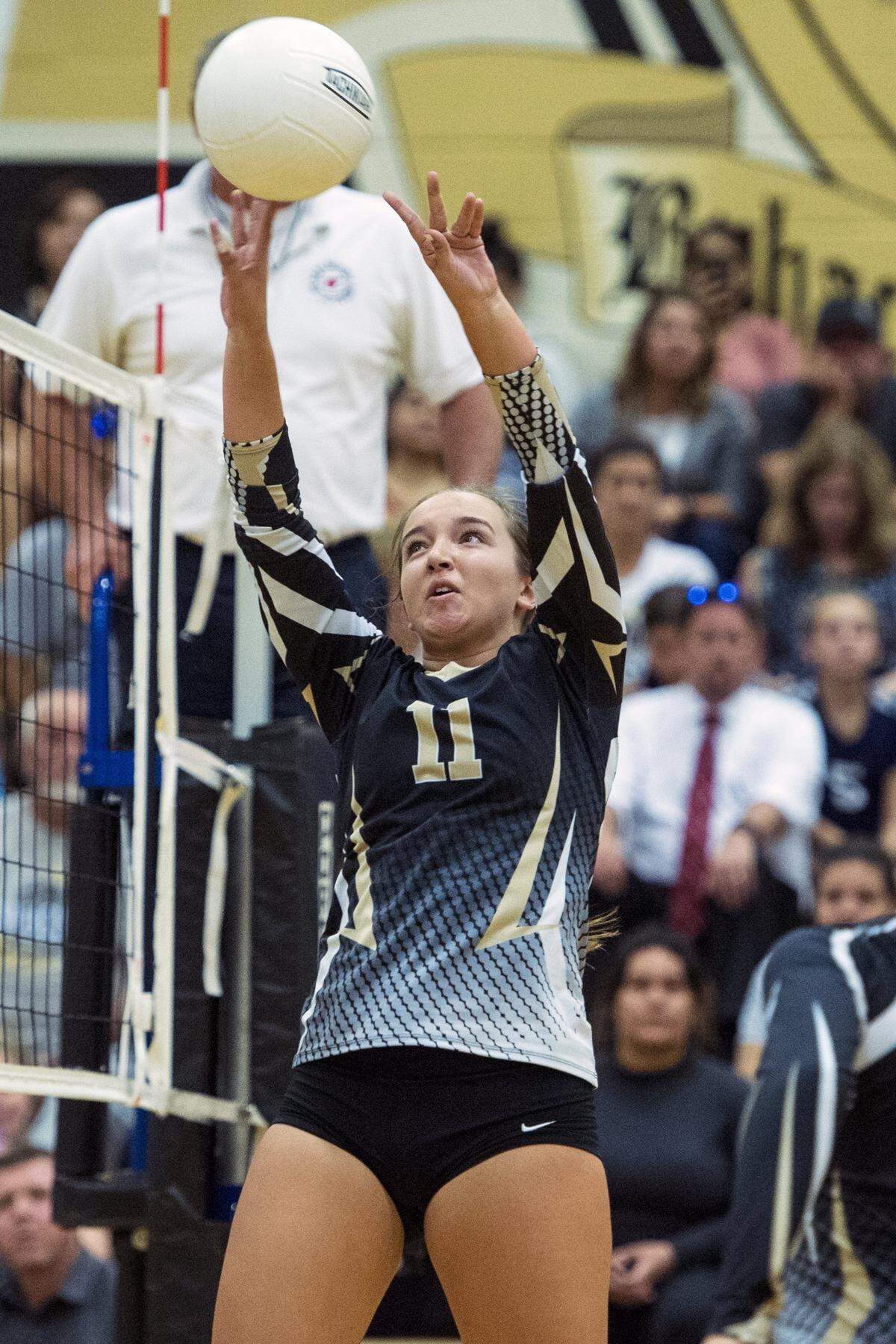 Buhach Colony senior Mallory Pazin (11) tips the ball over the net during a match against El Capitan at Buhach Colony High School in Atwater, Calif., on Wednesday, Sept. 19, 2018. 