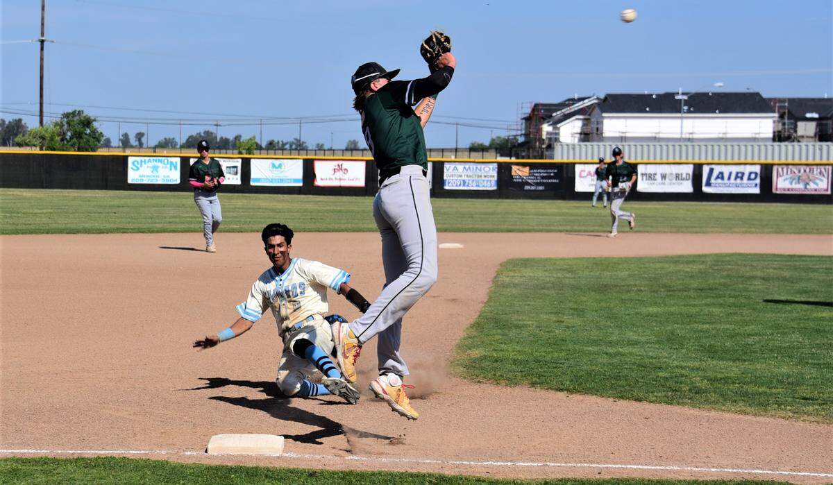 El Capitan High School sophomore Braylen Centeno tries to steal third as Granite Bay third baseman Cody Ferrante leaps for the throw during a playoff game on Thursday, May 11, 2023.