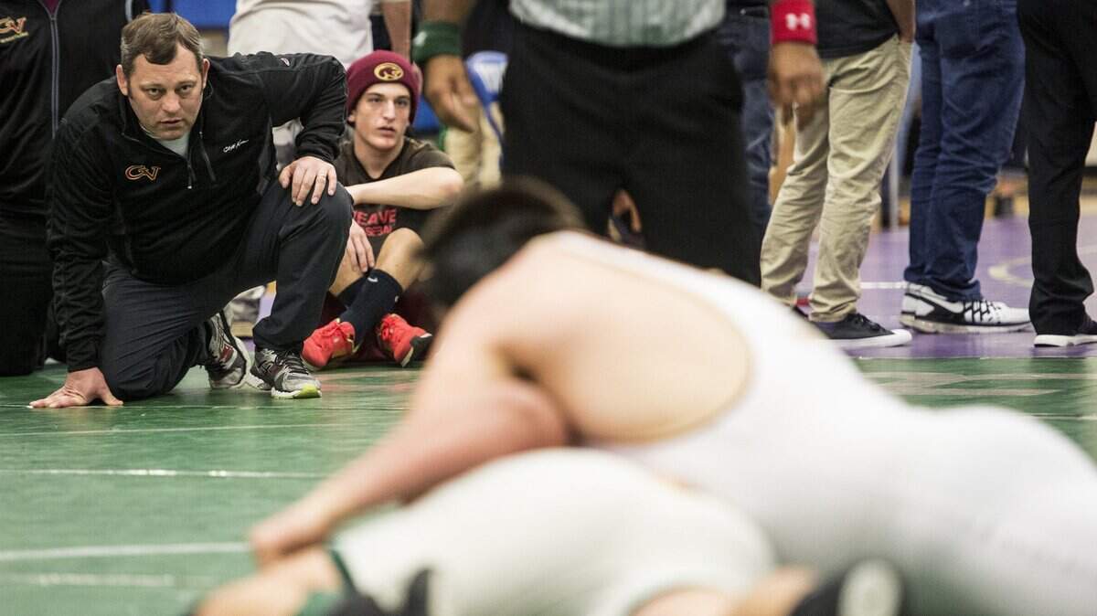 Golden Valley coach Chopper Mello looks on during a wrestling match in 2016. Mello recently picked up his 100th career Central California Conference victory as coach of the Cougars.
