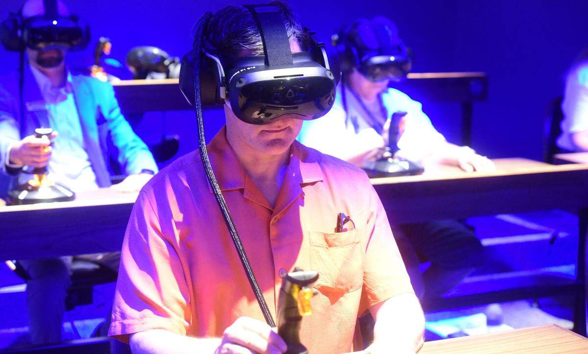 Merced City Councilmember Shane Smith tests out the new virtual reality tools at the launch of the new Dreamscape Learn Lab at Merced College on Friday, Aug. 9, 2024.