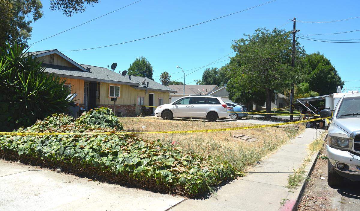 The Merced Police Department Crime Scene Response Team investigates a home on Monday, July 15, 2019, in the 1600 block of Merced Avenue in connection to a homicide the night before.