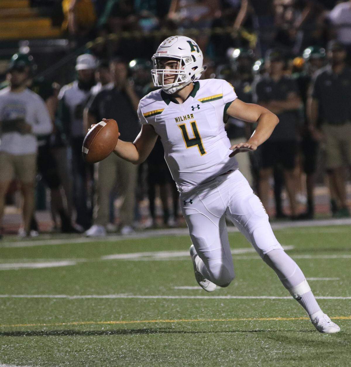 Hilmar quarterback Seth Miguel rolls out against Sonora on Friday, Sept. 13, 2019 in Sonora, Calif. Miguel threw three touchdown passes in a 28-7 win over the Wildcats as Hilmar improved to 4-0 on the season.